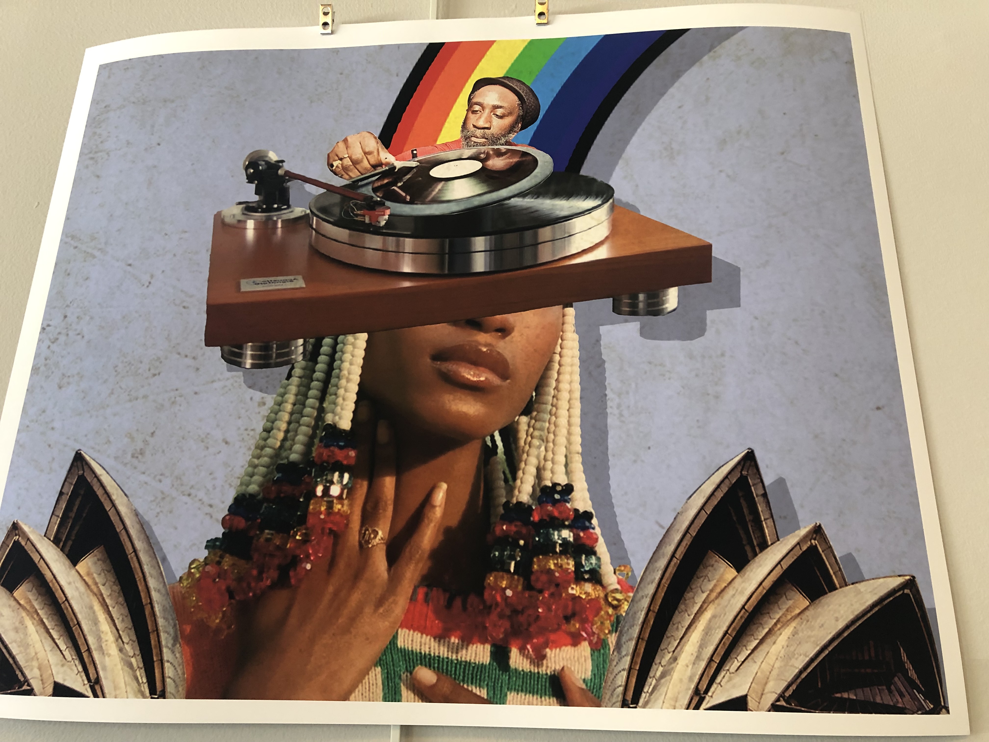 Artistic image of a Black woman with a DJ spinning records out of her head and an image of a rainbow bursting forth on the top. Kamau Grantham and Stacey Robinson, Selection of Her Thoughts (aka Her Mind Spins), Digital Collage, Â© 2021. Photo by Amy Penne.