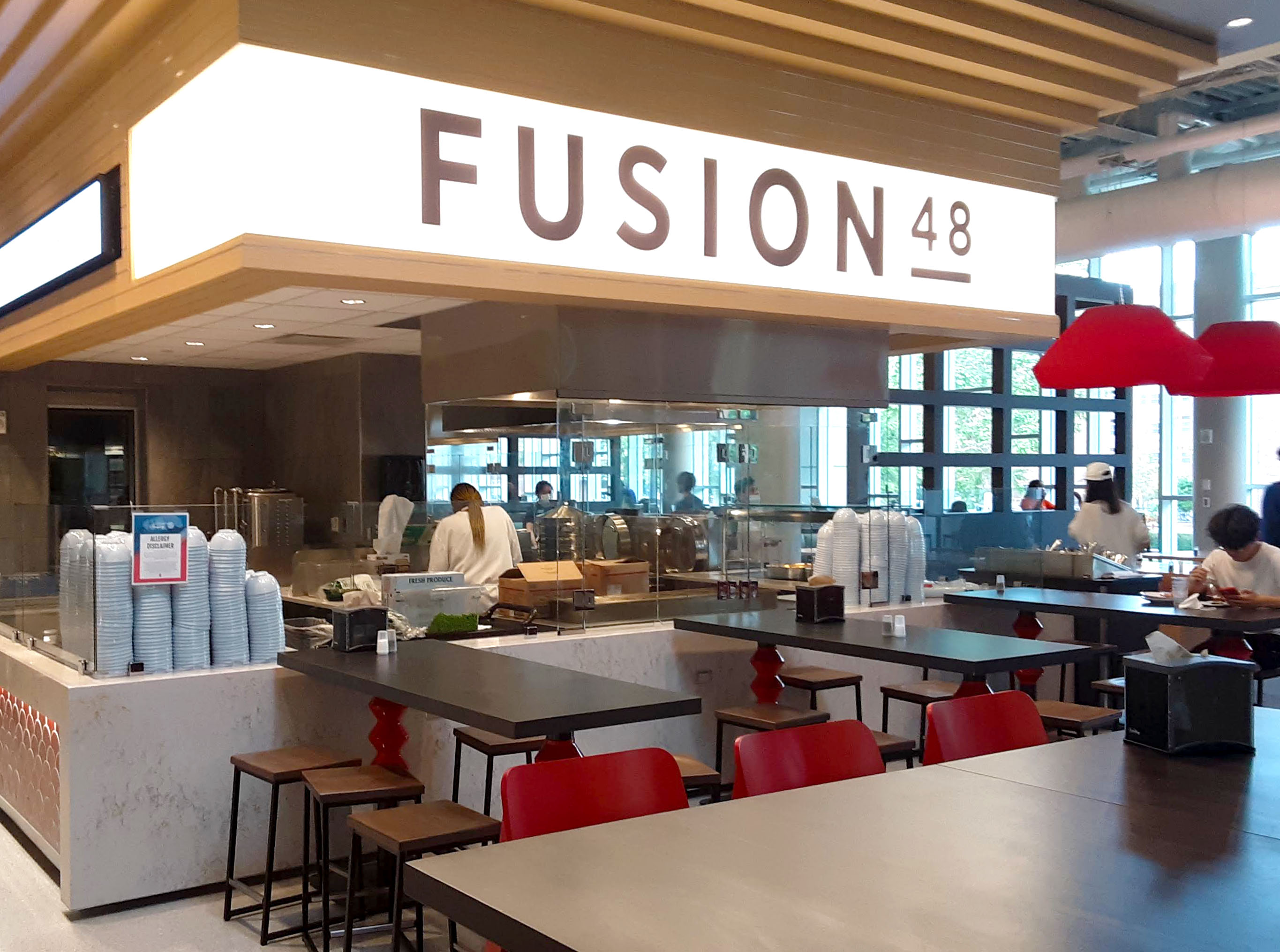 Inside the ISR Dining Hall, there is a restaurant called FUSION 48, and there is a sign with the name above a self serve counter. Photo by Paul Young.