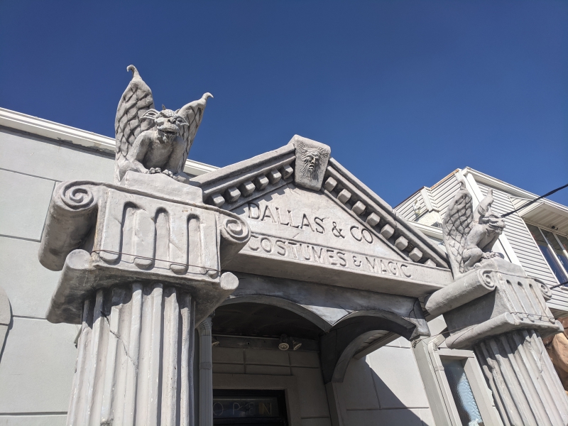 Two stone gargoyles frame the entrance to Dallas and Co., an entrance that is designed to look like roman columns. Photo by Tom Ackerman.