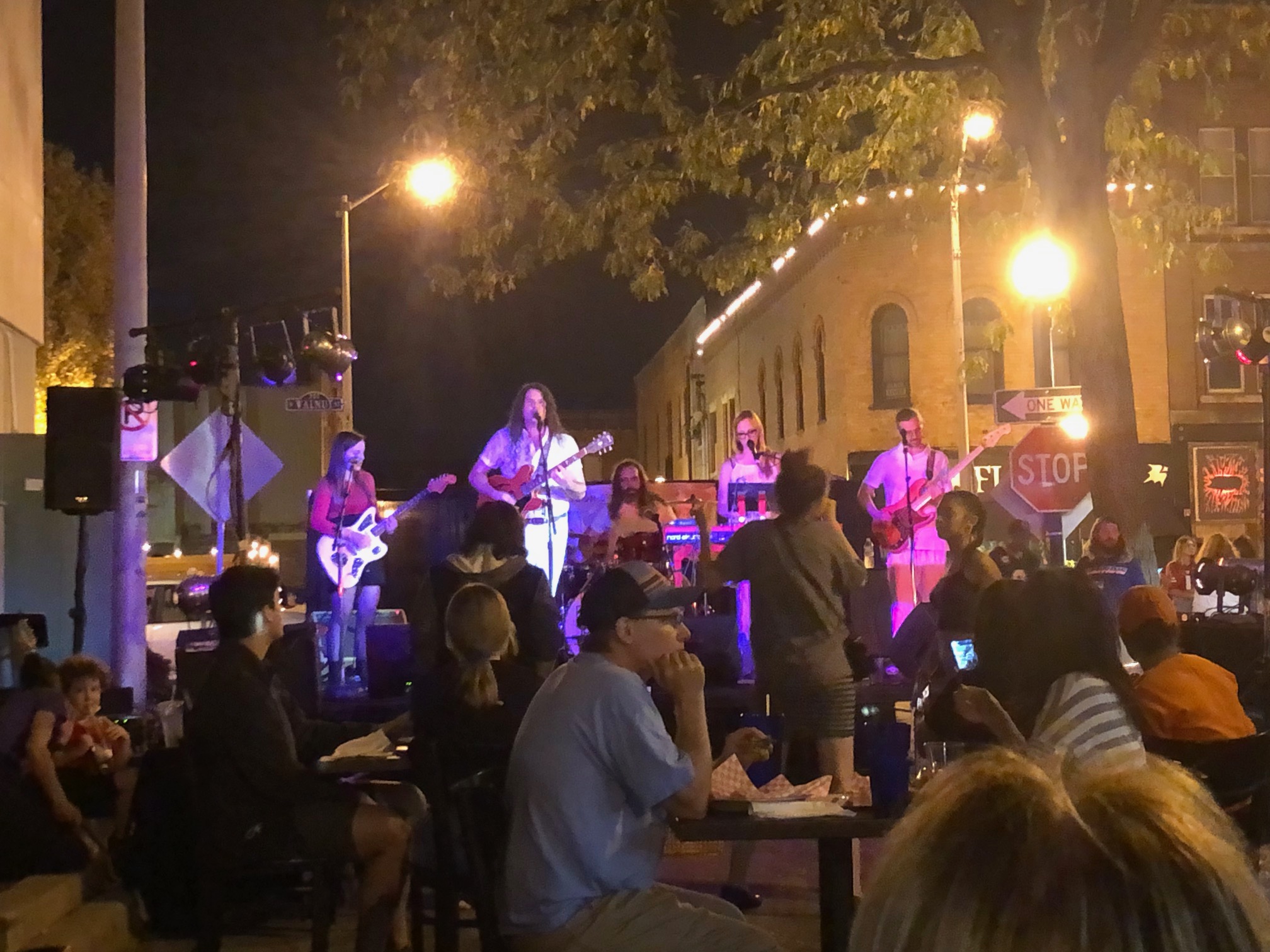 The band Modern Drugs is playing for an outdoor crowd at Toast to Taylor Street. Photo by Alyssa Buckley.