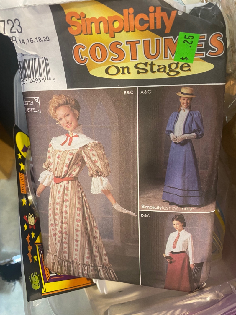 The front of a package of sewing patterns. There are three women dressed in prairie-style clothing. Photo by Julie McClure.