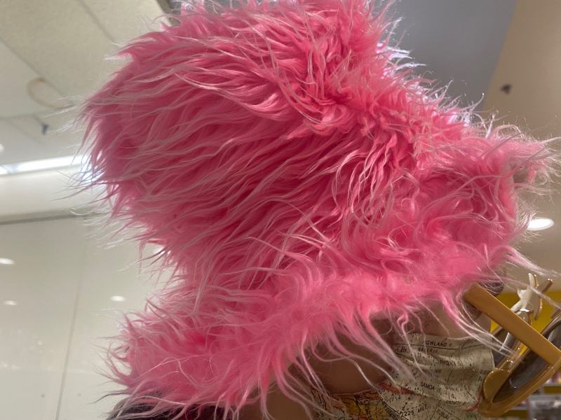 A top hat that is covered in long pink fur. Photo by Julie McClure.