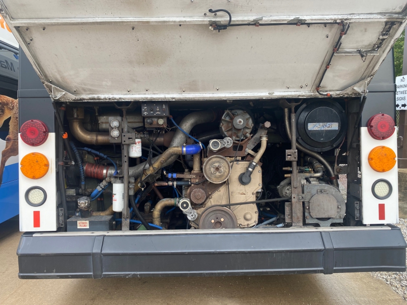 Inner workings of a regular MTD buses. A different configuration of pipes and tubes, and there is a dirty film over everything. Photo by Julie McClure.
