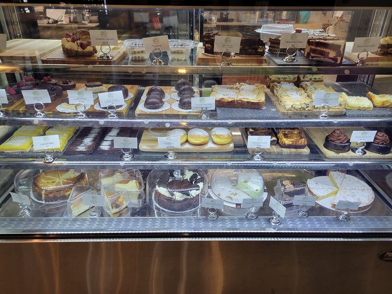 Another Pekara display case with a bunch of cakes, bars, and chocolate desserts. Photo by Matthew Macomber.