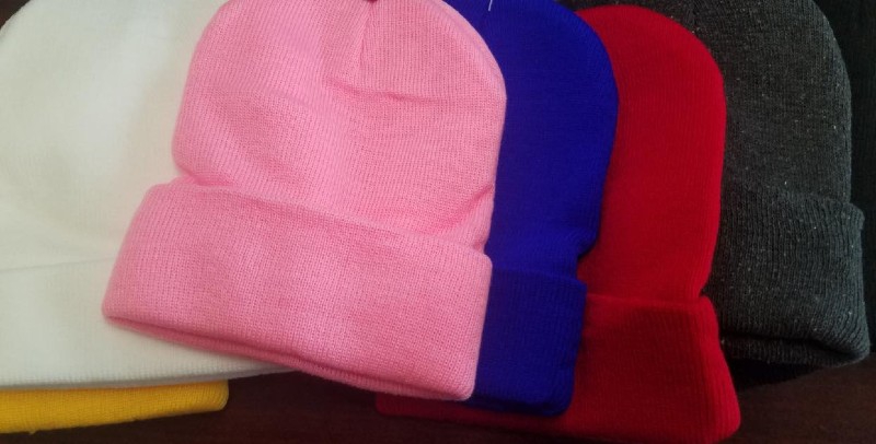 A row of stocking caps: pink, blue, red, gray. Photo from Cunningham Supervisor's Township Facebook page. 