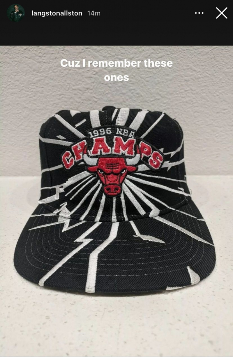 A screenshot of a black hat with white lightening bolts. In the center is the red Bulls logo, and it says 1996 NBA Champs above it. Screenshot from Instagram. 