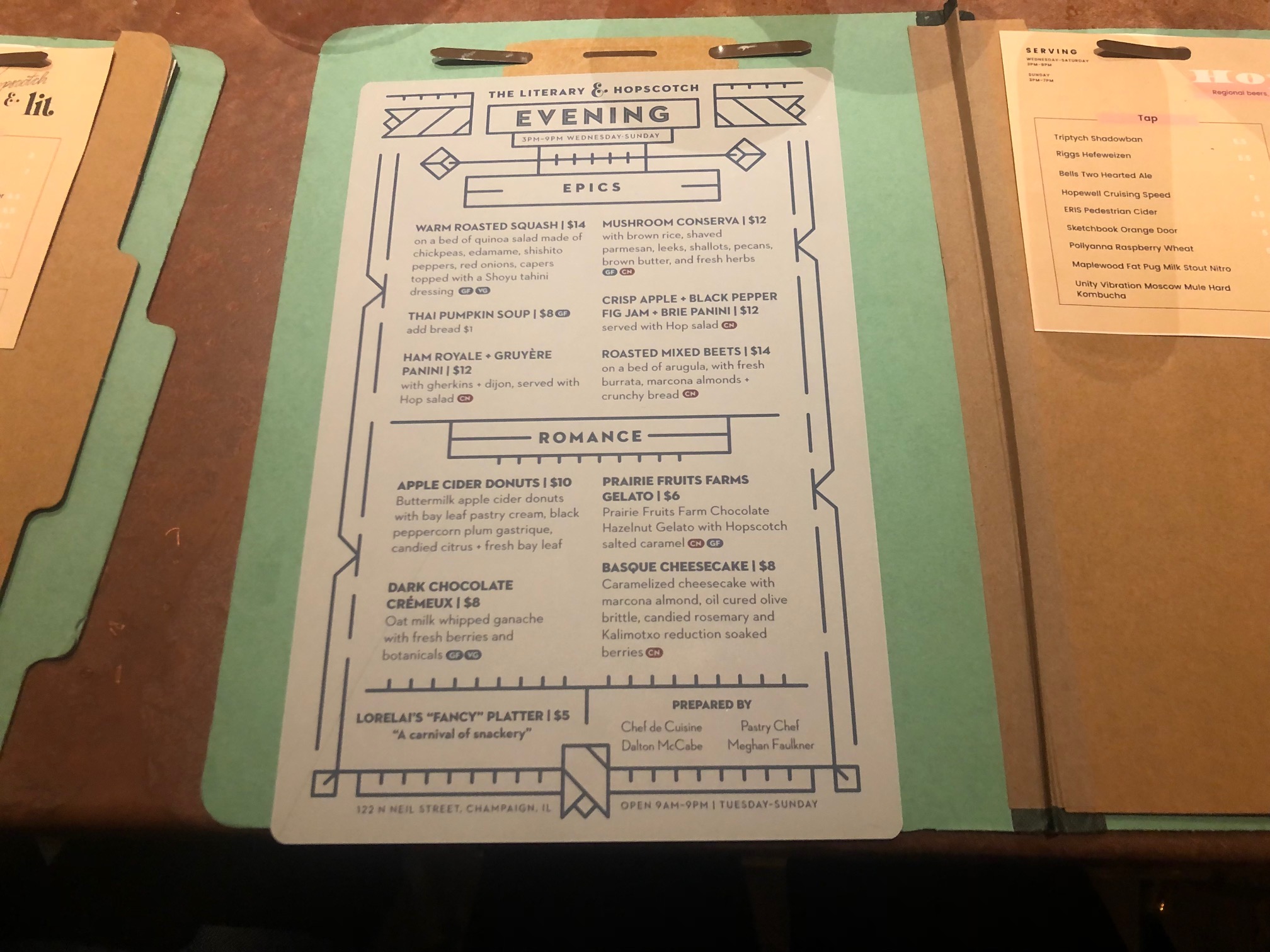 Inside a vintage file folder, there is an evening food menu beside a half page of beer list.  Photo by Alyssa Buckley.