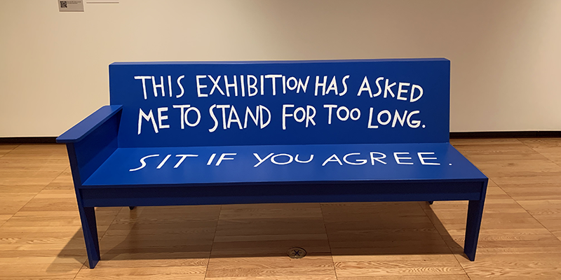 Blue bench with the words 