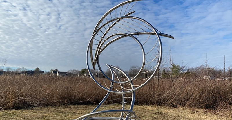 Circular metal sculpture at Meadowbrook Park. Photo from the Urbana Park District Facebook page.